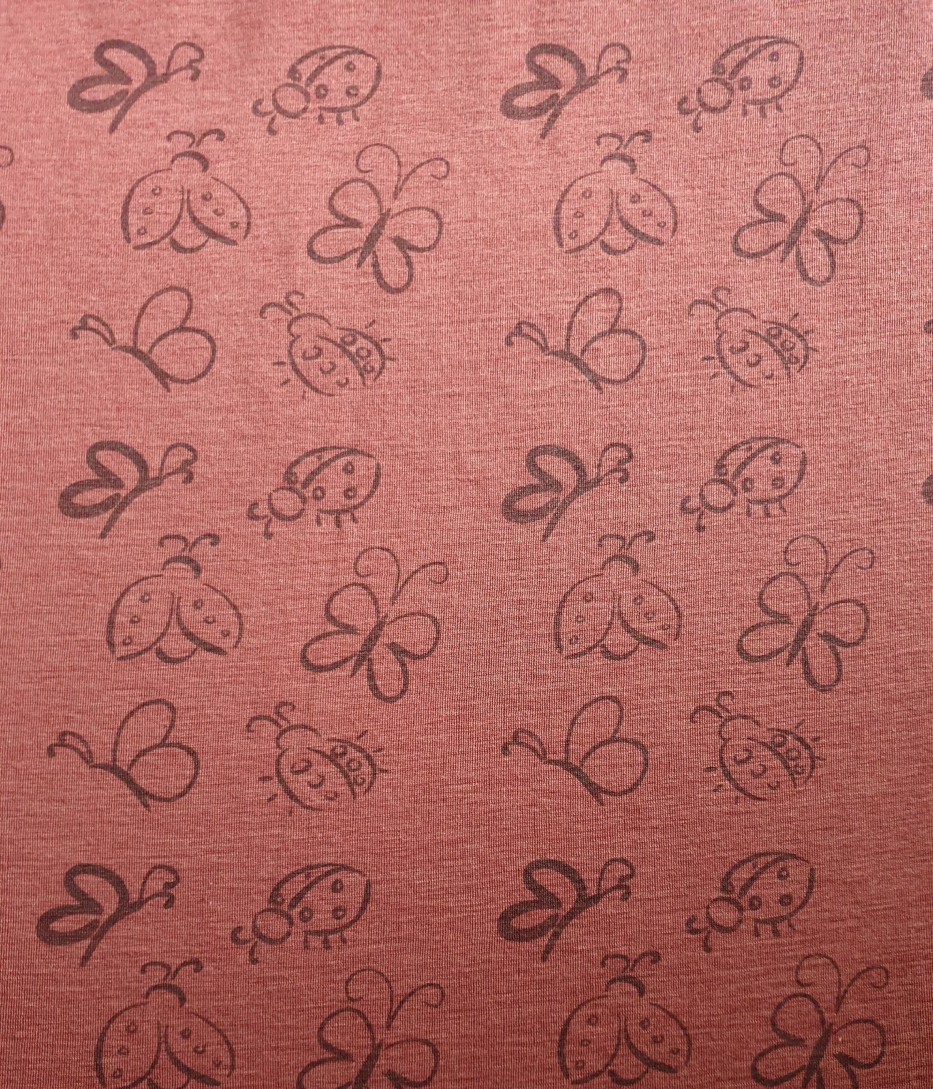  Bio Wolle / Seide Jersey Marienkäfer & Schmetterling auf Ziegelrot (kbT) 